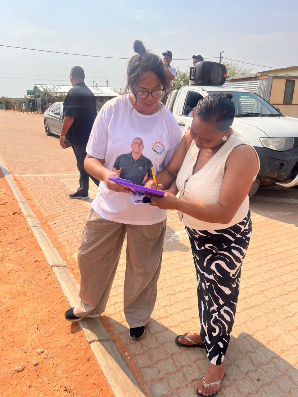 PMC member signing up a resident